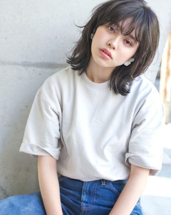 Everything You Need To Know About The Wolf Haircut Trends