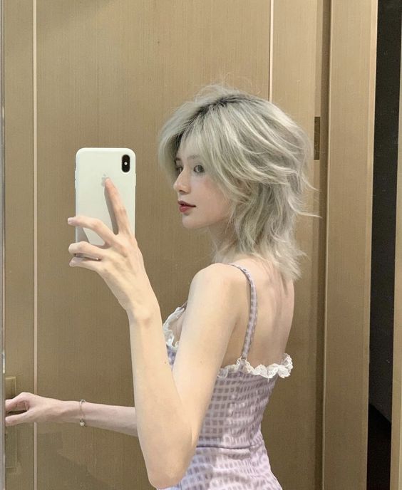 Everything You Need To Know About The Wolf Haircut Trends